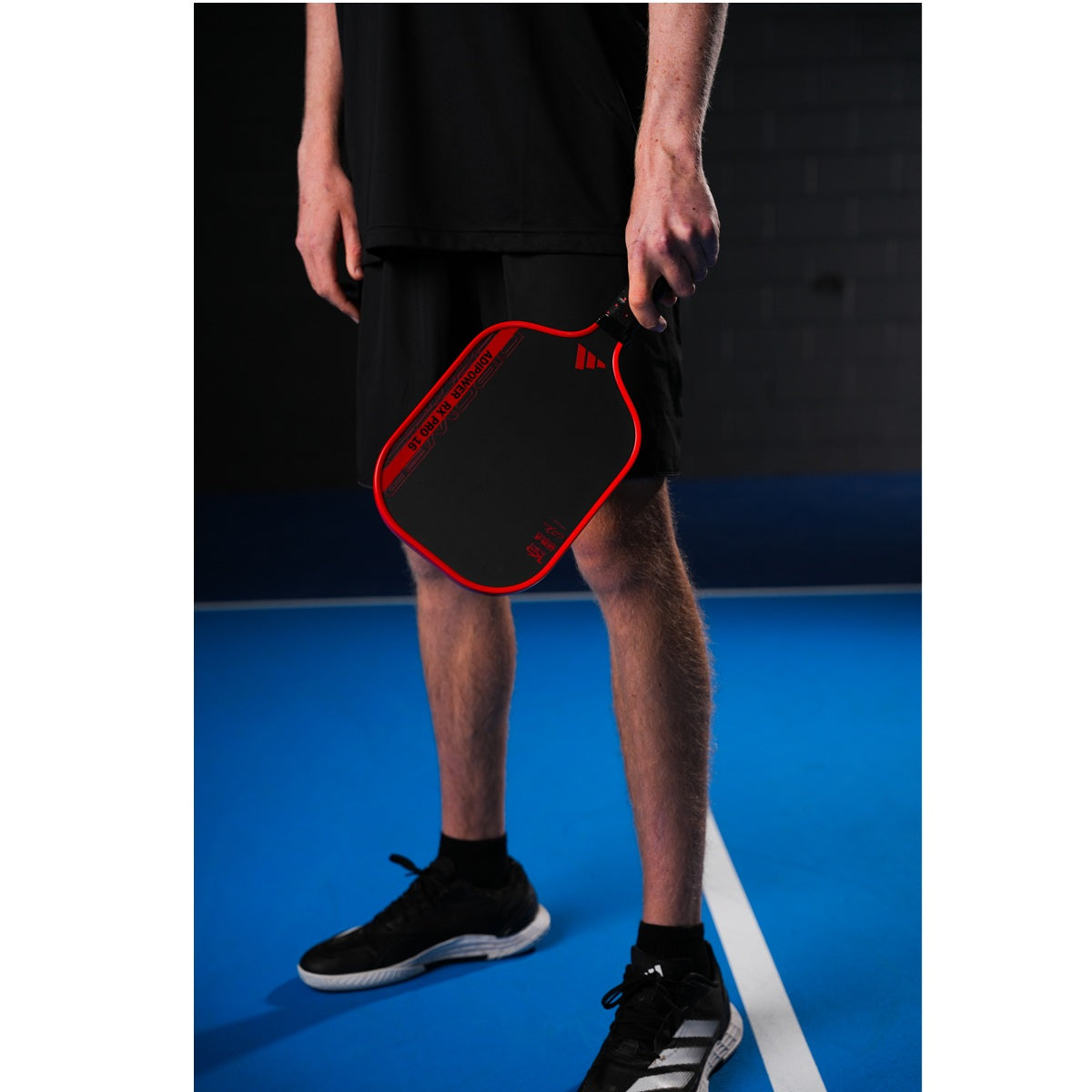 Adidas CJ Klinger Adipower Pro EDT Pickleball Paddle - padel held by man