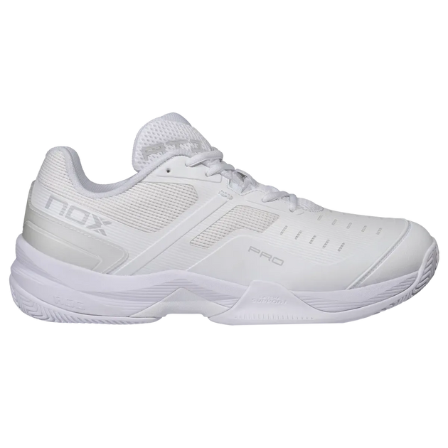 A white Nox Pro tennis shoe shown from a side profile view against a plain white background.